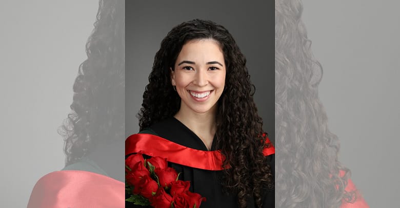 Rielle Gagnon in a graduation gown with roses